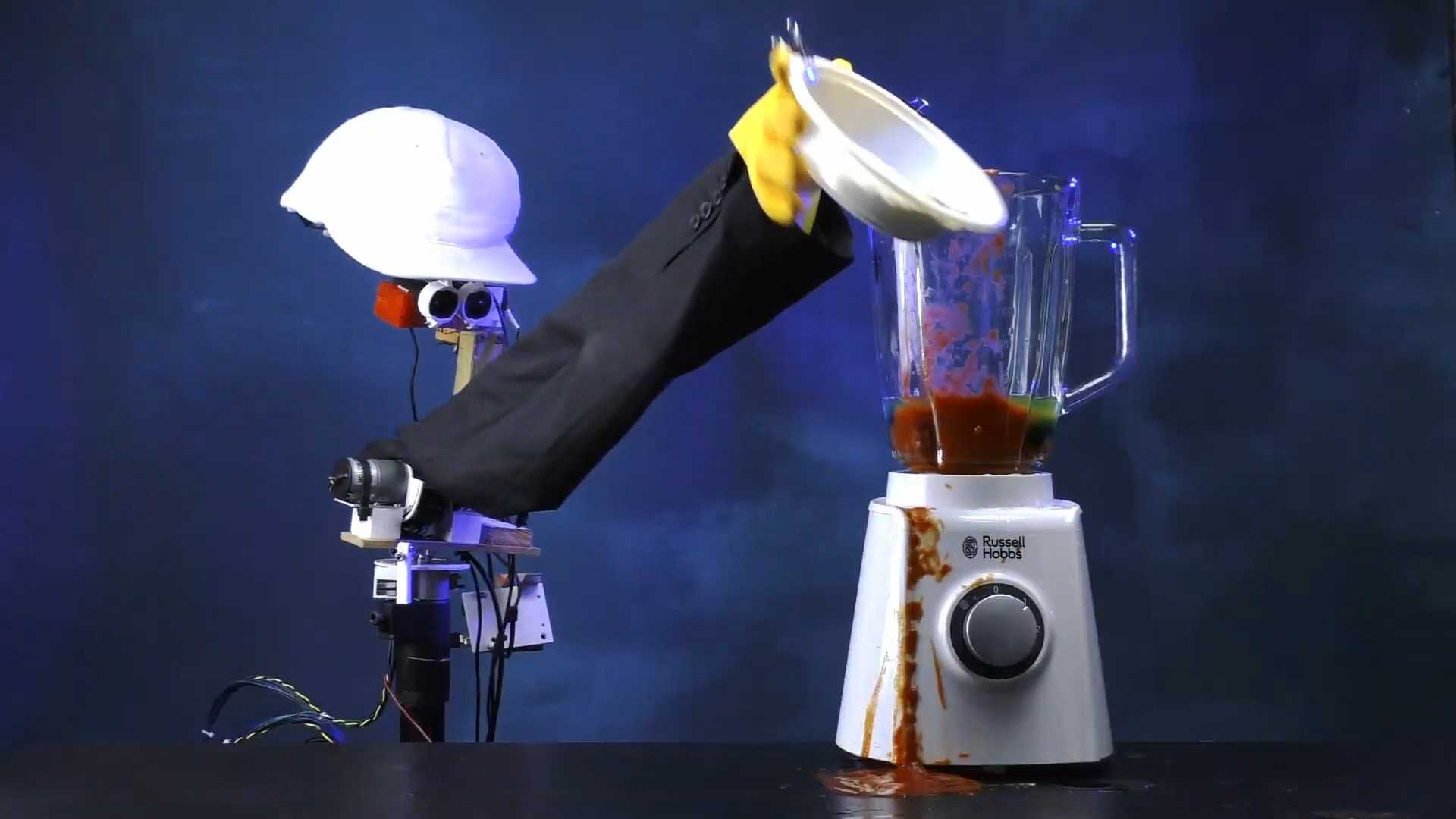 A naff robot attempting to blend a cocktail